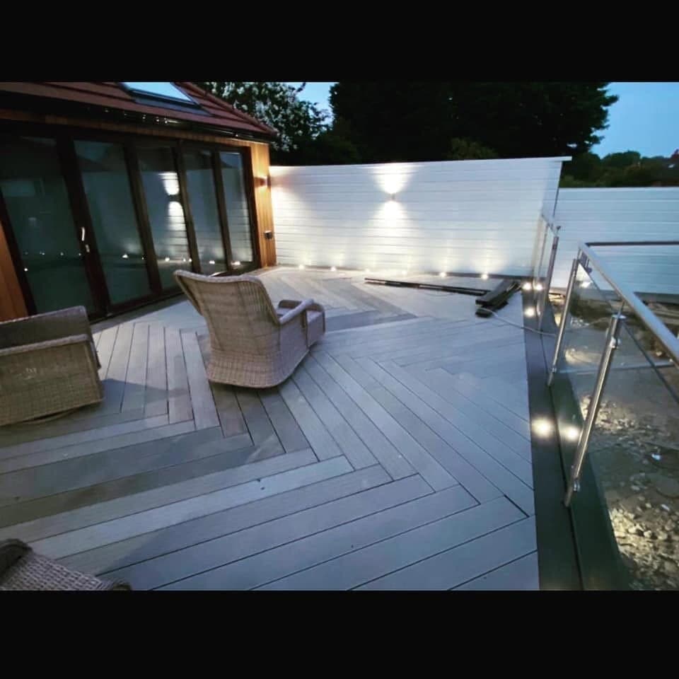 Raised balcony deck with recessed floor lights and a glass balustrade