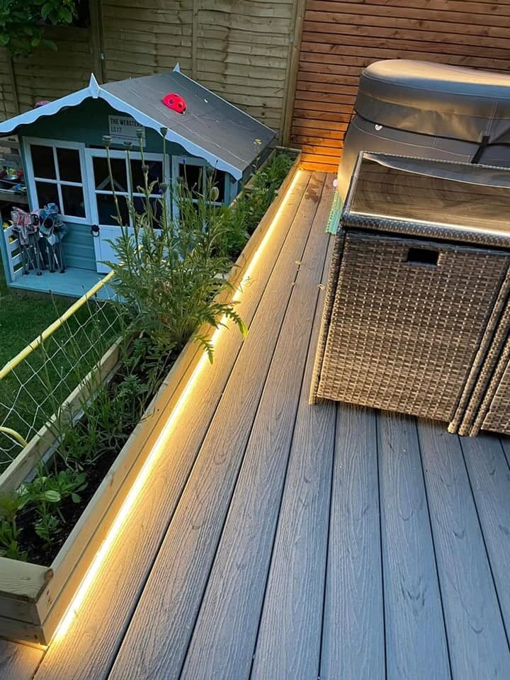 Garden room and deck edged with warm LED strip lighting