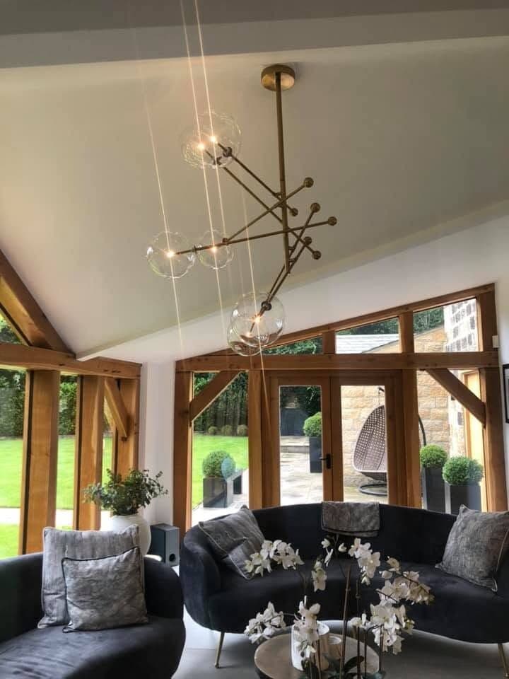 Open-plan lounge with a sputnik-style statement pendant over the seating area