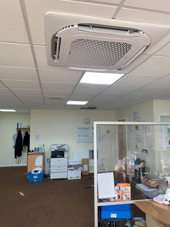 Ceiling cassette air conditioning fitted in a working office